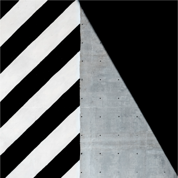 a rectangle of diagonal black and white lines next to a rectangle made up of a grey triangle and a black triangle.
